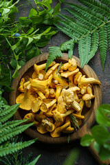 forest chanterelle mushrooms in wood plate