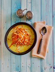 shredded carrot in a coconut curry and ginger soup