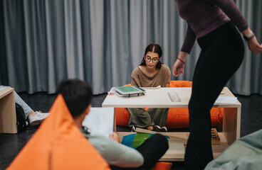 Students are interactively studying in a comfortable school environment, emphasizing collaborative...