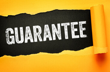 GUARANTEE written in bold, distressed white letters on a black background revealed through torn...