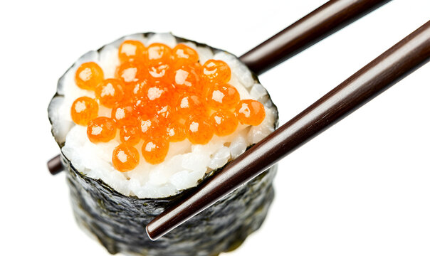 A close-up of chopsticks holding a single gunkan maki sushi roll topped with bright orange ikura salmon roe. - Powered by Adobe