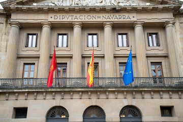 Government building in Pamplona, Navarra featuring flags of Spain and the European Union