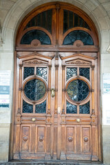Intricately designed wooden entrance doors in Pamplona, Navarra showcasing beautiful craftsmanship...