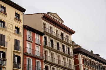Historic architecture along a quiet street in Pamplona, Navarra, España showcases intricate...