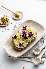 bruschetta with cottage cheese, pear, walnut and honey