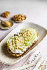 bruschetta with cottage cheese, pear, walnut and honey
