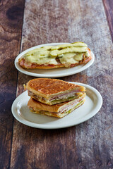 Cuban sandwich with ham, pork, swiss cheese and pickles, no placemat