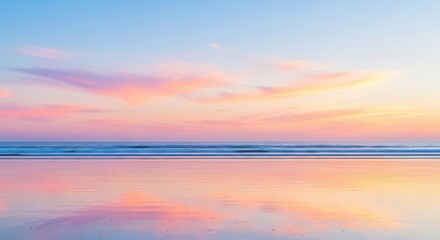 Obraz premium The tranquil beach reflects the vibrant colors of the sunset sky