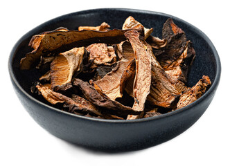 Organic dried forest mushrooms mix chantere porcini gourmet wild fungi in black bowl on transparent...
