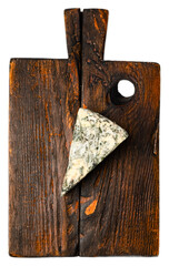 Blue moldy cheese wedge with marbled veining on rustic wooden cutting board with dark background