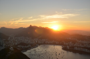Sunset at night on Rio de Janeiro with city lights and the sea and the mountains