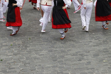 Basque dancers in a traditional costume during a folk event