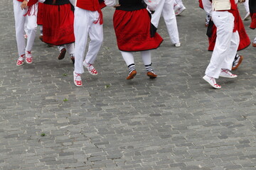 Basque dancers in a traditional costume during a folk event