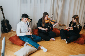 Musicians practicing together on various instruments indoors, featuring clarinet, violin, and flute...