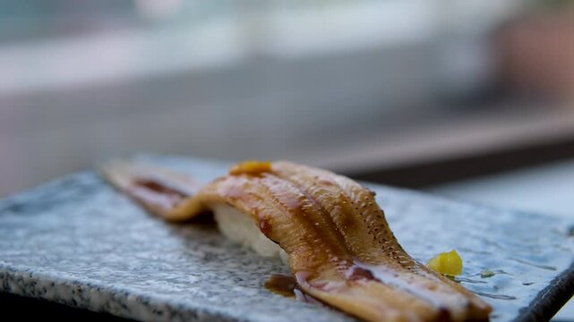 4K fottage. Place the conger eel nigiri sushi on the counter. High quality 