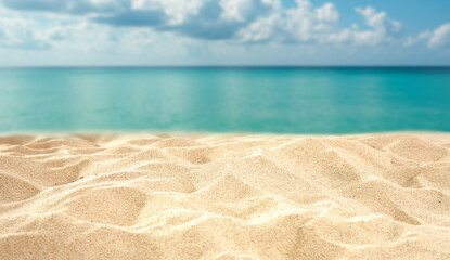 Close-up of golden sand with empty space for product placement, tropical beach background with turquoise sea, blue sky, and summer sunlight – perfect for vacation or wellness branding