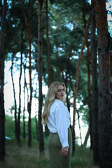 Portrait of a beautiful woman in the forest. High quality photo