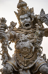 Statue of God fighting with monkeys in Pura Luhur Uluwatu, Bali, Indonesia