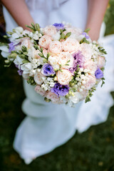 Bride Holding Elegant Flower Bouquet on Wedding Day Celebration