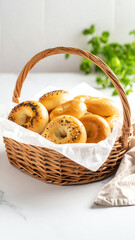 Freshly baked bagels in a woven basket, perfect for breakfast or brunch, showcasing a variety of flavors and toppings.