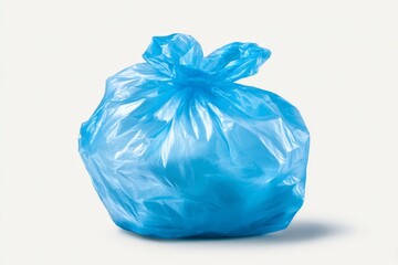 Blue plastic bag filled with trash resting on a clean surface in a well-lit environment