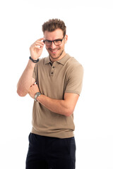 Fototapeta premium Studio shot of a handsome young man standing against isolated white background