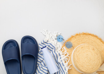 Blue beach accessories on color background, top view. Copy space for text