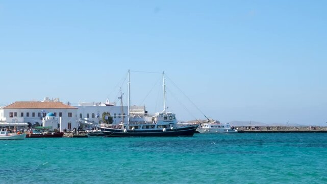 famous windmills of Mykonos island over seascape, Mykonos island, Greece. High quality 4k footage