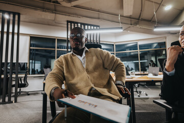 A professional setting with coworkers actively participating in a meeting, sharing ideas and...