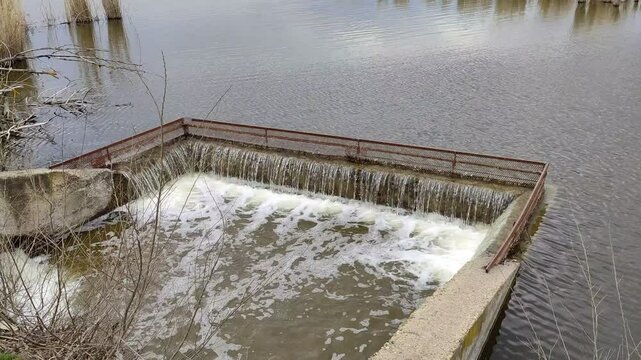 River flows into a water intake or overflow collector