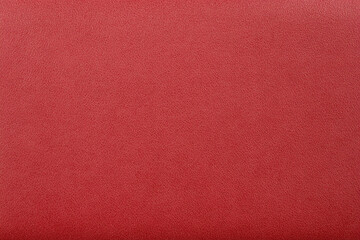 Fototapeta premium Solid pastel red background with matte finish showcasing a sleek and smooth texture for design purposes