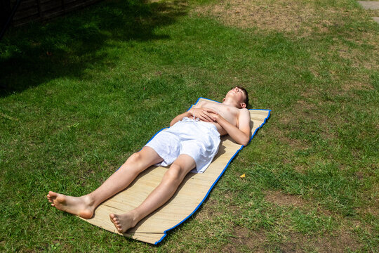 Teenage boy sunbathing