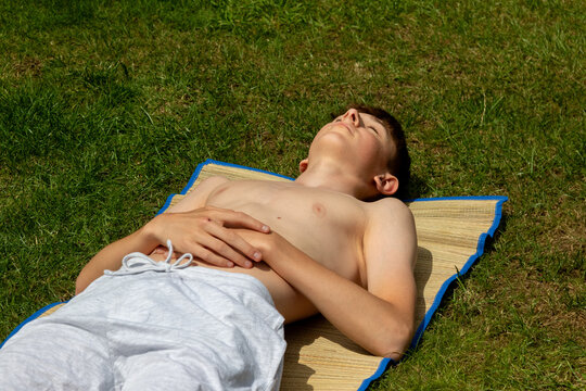 Teenage boy sunbathing