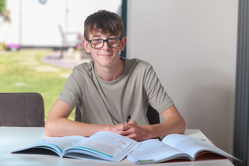 Teenage boy doing home work