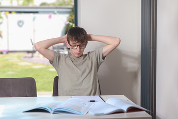 Teenage boy doing home work