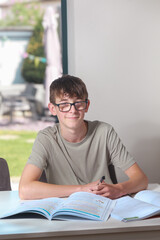 Teenage boy doing home work