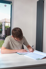 Teenage boy doing home work