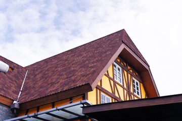 Beautiful looking windows on the roof of the house, The top of the house or apartment building with...