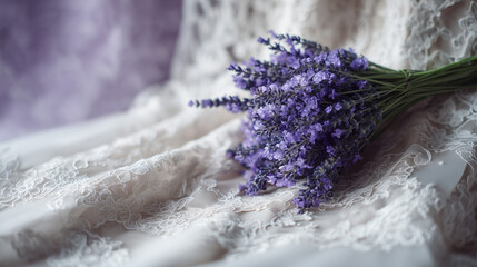 Lavender bouquet on soft lace fabric with a pastel background  