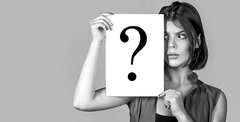 Question mark, symbol. Girl question. Woman holding a placard with question mark symbol, thinking....