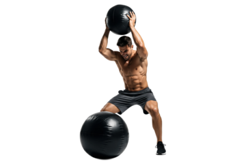 Muscular man performing a medicine ball slam exercise with two black balls