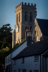 St Michaels church catching golden evening light at Beer in Devon
