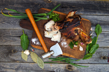 Appetizing smoked pork shank with herbs, solt and spices