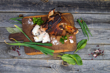 Appetizing smoked pork shank with herbs and spices