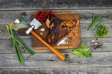 Appetizing smoked pork shank with herbs, garlic and spices