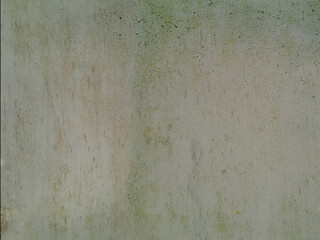 Old green painted wall with rust spots. Grunge texture.