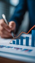 Financial analyst examining growth charts and market performance data with rising trend line visualization