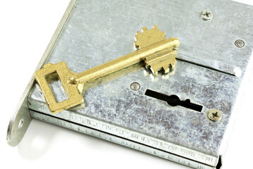 Brass key for opening the lock in the house.