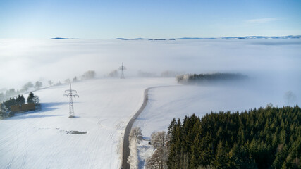 View of the snowy landscape of the Krkonoše Mountains during an inversion