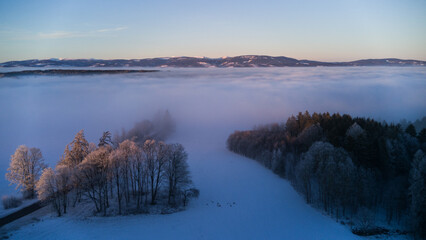 View of the snowy landscape of the Krkono&scaron;e Mountains during an inversion